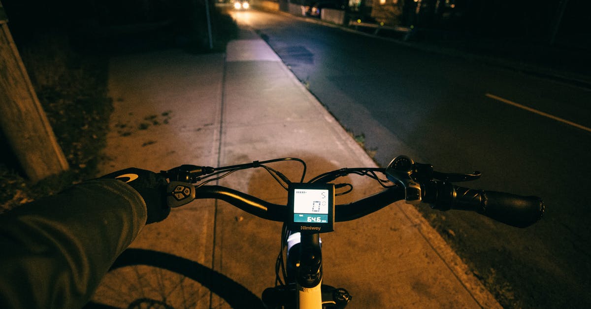 Do Gamecubes (DOL-001) without Digital AV exist? - Black and Gray Bicycle on Gray Concrete Road during Night Time