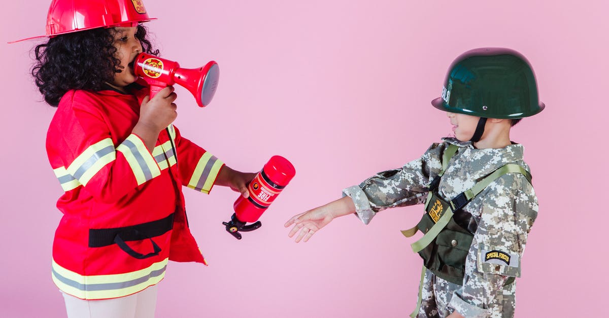 Do I have to unlock heroes in Overwatch? - Side view of multiracial children in military uniform and fireman costume with megaphone and fire extinguisher standing together on pink background in helmets