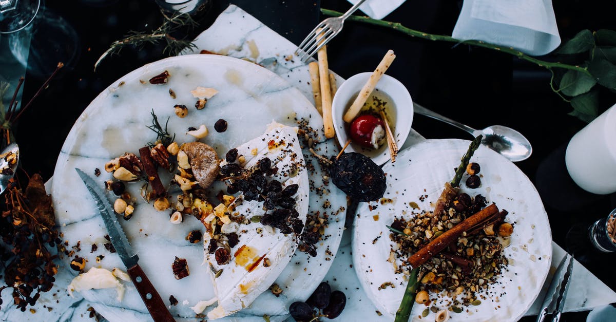 Do my troops recover fully after each battle? - From above of plates with remains of various dishes left after festive dinner on table with cutlery and flowers