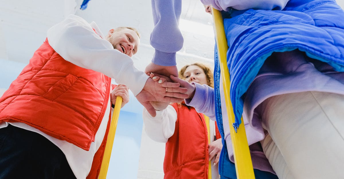 Do open Chalice Dungeons close when the game is beaten? - From below of satisfied curling players spreading hands and joining palms together during game