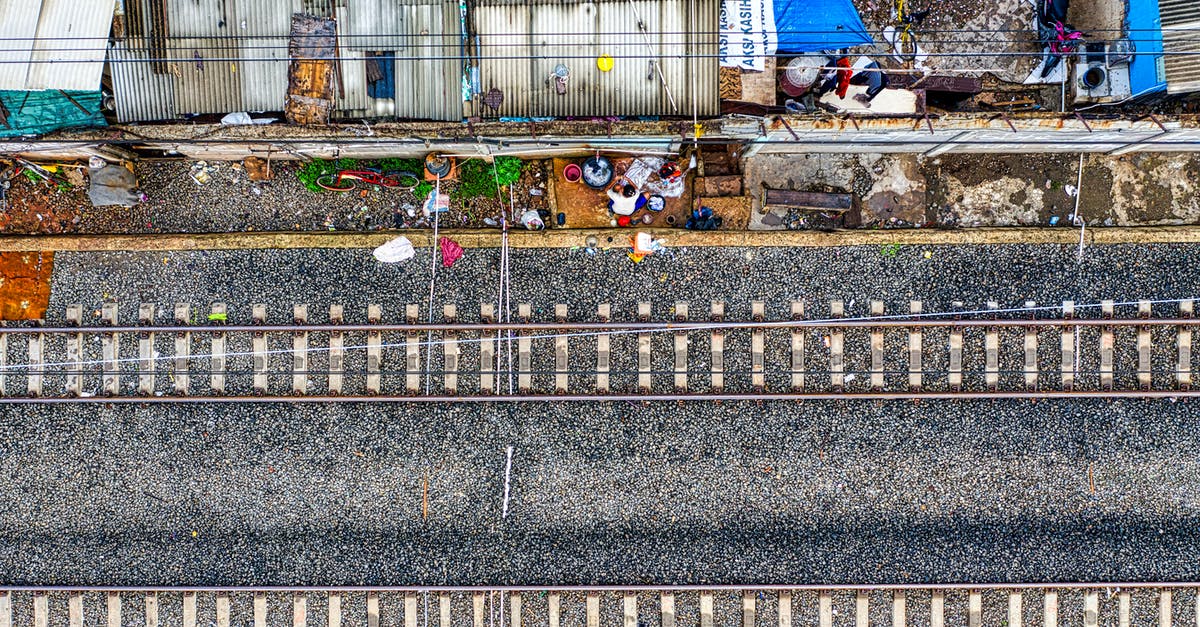 Do the Double Shot and Bloonjtsu upgrades pierce more bloons? - An Aerial View of a  Double Train Tracks on Gray Road Near Houses