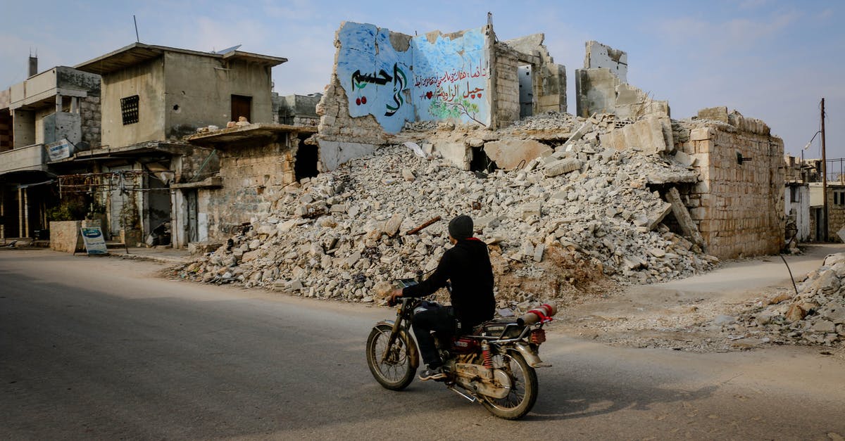 Do the first two encounters in the ruins count for the speedrun genocide route in Undertale? - Full body side view of anonymous man riding motorcycle on road near heap of ruins and destroyed buildings in poor district Do the first two encounters in the ruins count for the speedrun genocide route in Undertale? - Full body side view of anonymous man riding motorcycle on road near heap of ruins and destroyed buildings in poor district