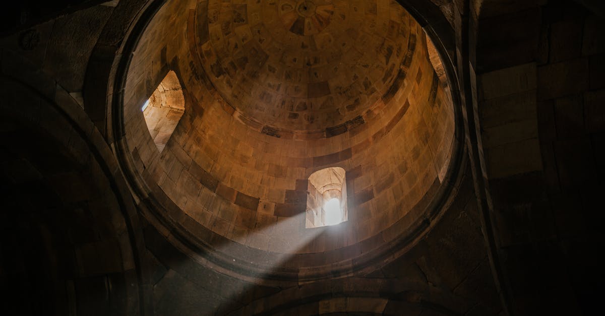 Do the Skaal believe in reincarnation or not? - From below of bright sunshine illuminating through window of dome in ancient stone cathedral