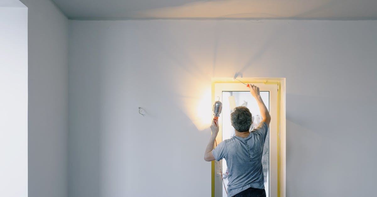 Do you need to remove buildings to remove cultural penalty? - Faceless man repairing door in room