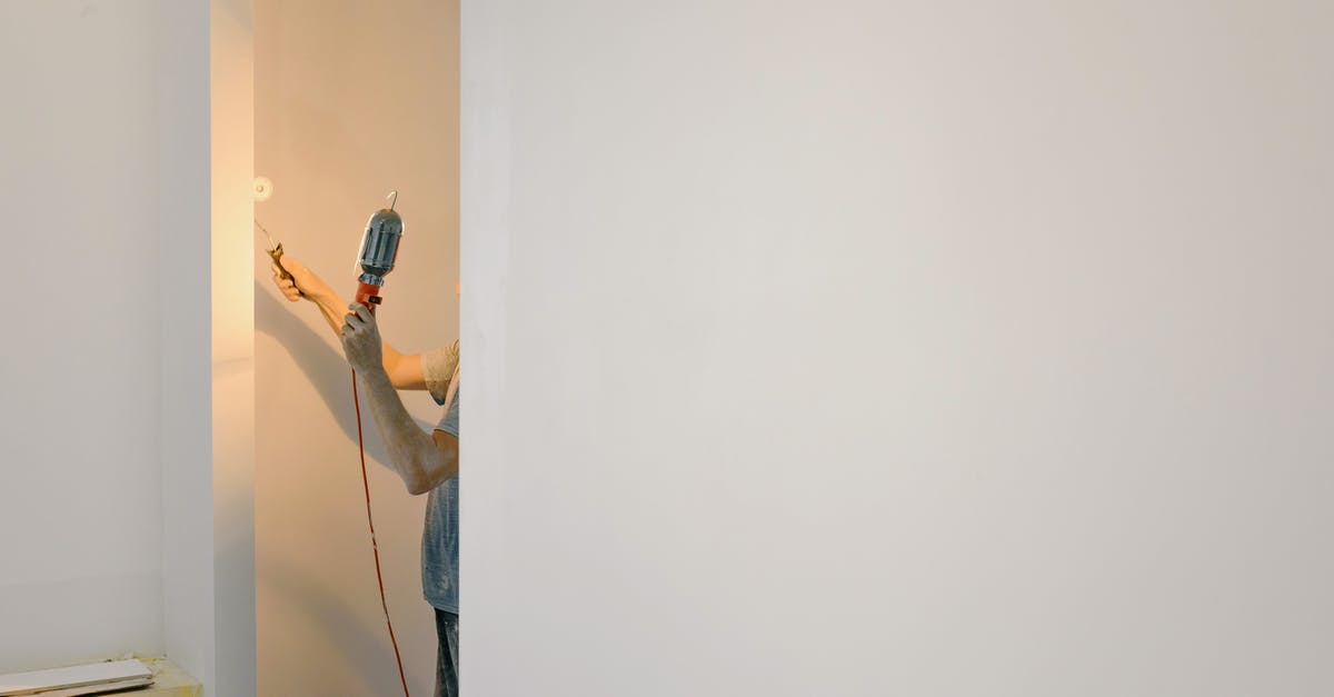 Do you need to remove buildings to remove cultural penalty? - Crop man painting walls in room