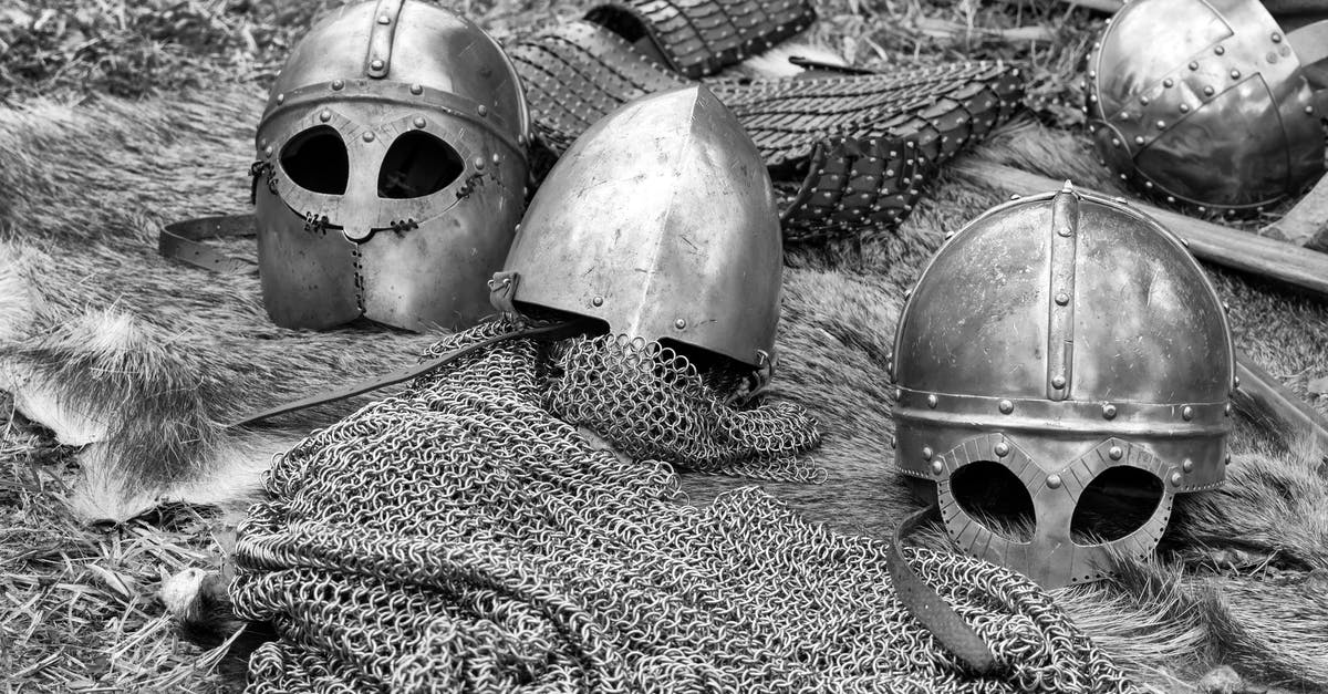 Does armor prevent injury? - Grayscale Photography of Chainmails and Helmets on Ground