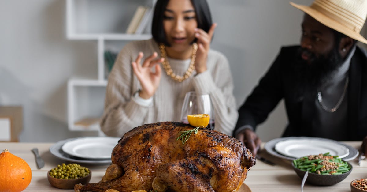 Does Big Hat Logan restock? - Diverse couple at table with turkey