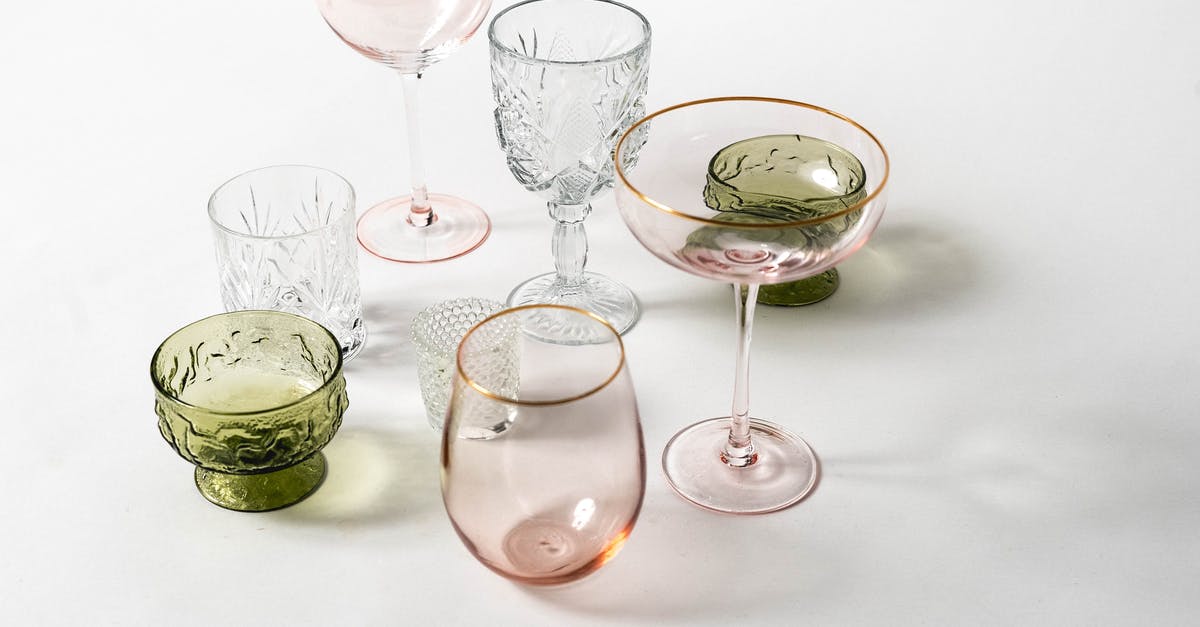 Does crystal charge stack? - From above collection of various colorful glasses for different drinks with different shapes placed on white background in light studio