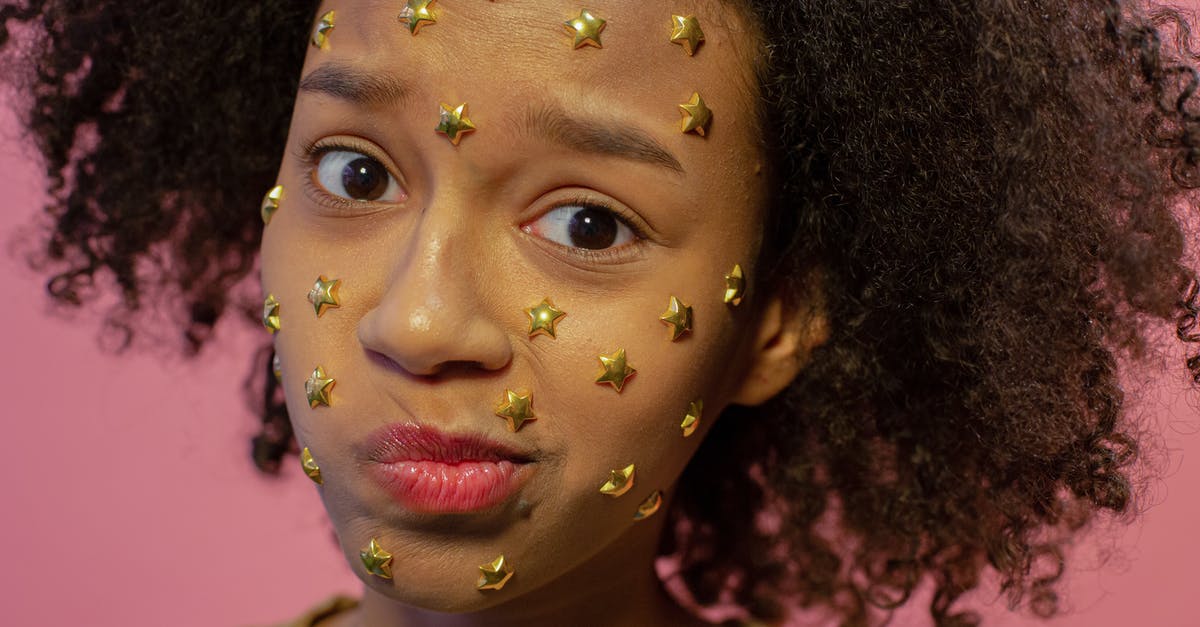 Does Darth Vader's punishing grip star card, make his choke do more damage? - Stylish African American female teenager with abundance of yellow decorative stars on face looking at camera and making face on pink background