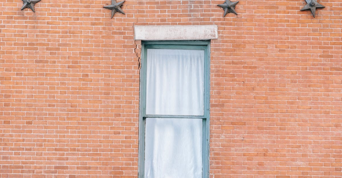 Does Darth Vader's punishing grip star card, make his choke do more damage? - Exterior of aged red brick building with curtained window and star shaped decoration