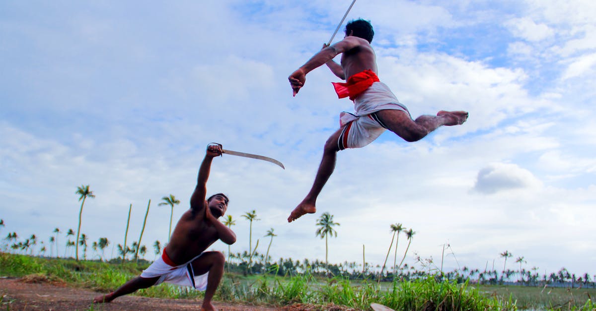 Does dual wielding looting swords stack? - Two Man in White Shorts Fighting Using Sword during Daytime