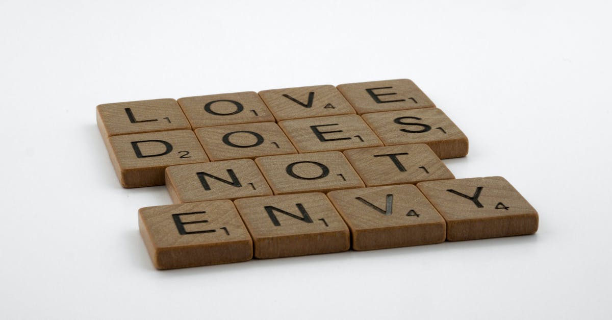 Does "Full metal jacket" synergize with "Elder Blank"? - Close-Up Shot of Scrabble Tiles on a White Surface