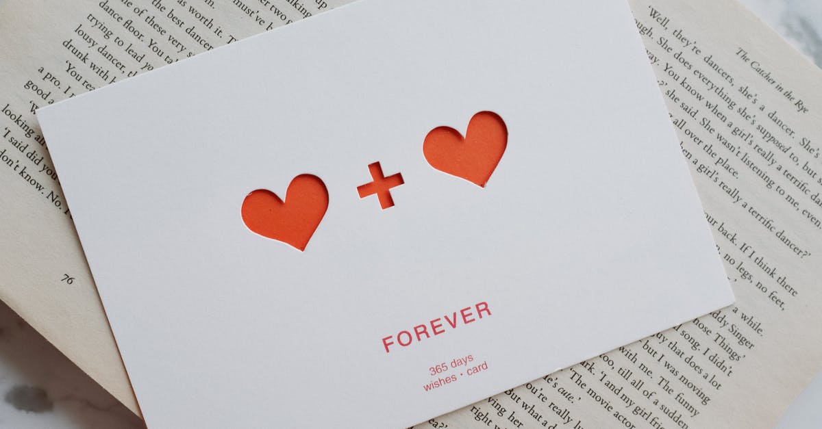 Does "Sketchy Information" draw the highest available cost card? - Top view of white paper postcard with cutout red hearts placed on top of opened novel book