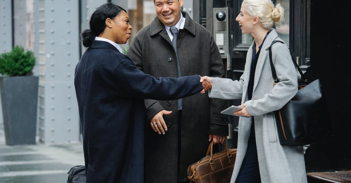 Does the Anti-Bio Beam deal friendly fire? - Positive diverse colleagues shaking hands after meeting on street