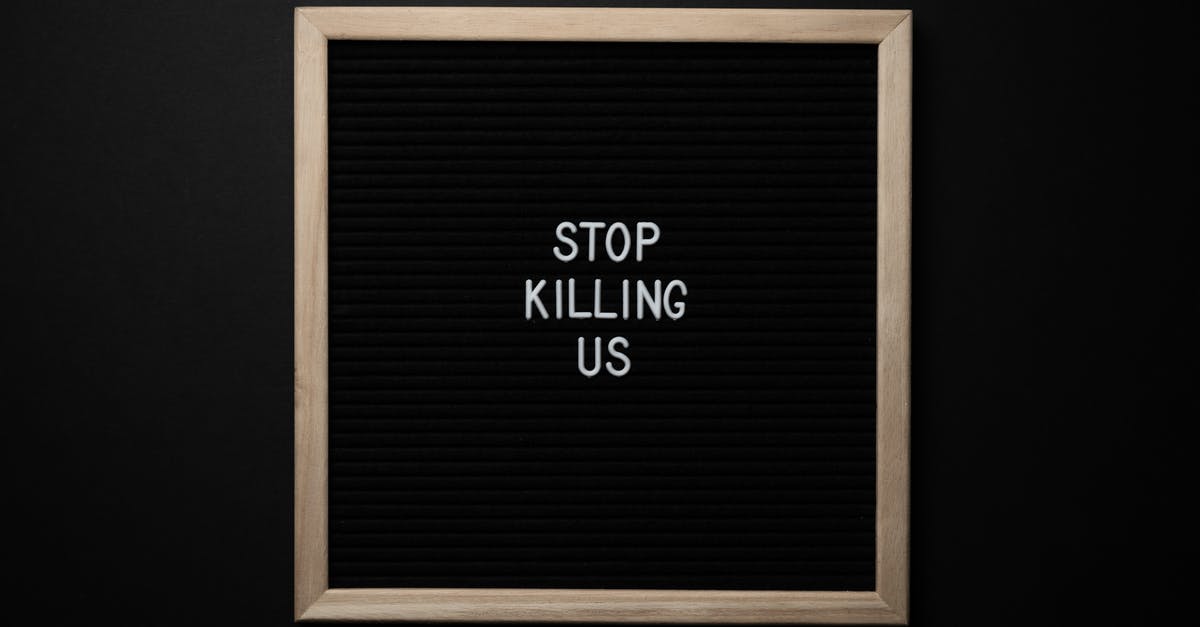 Does the Bowcaster kill in one shot? - Top view of slogan Stop Killing Us on surface of square blackboard on black background