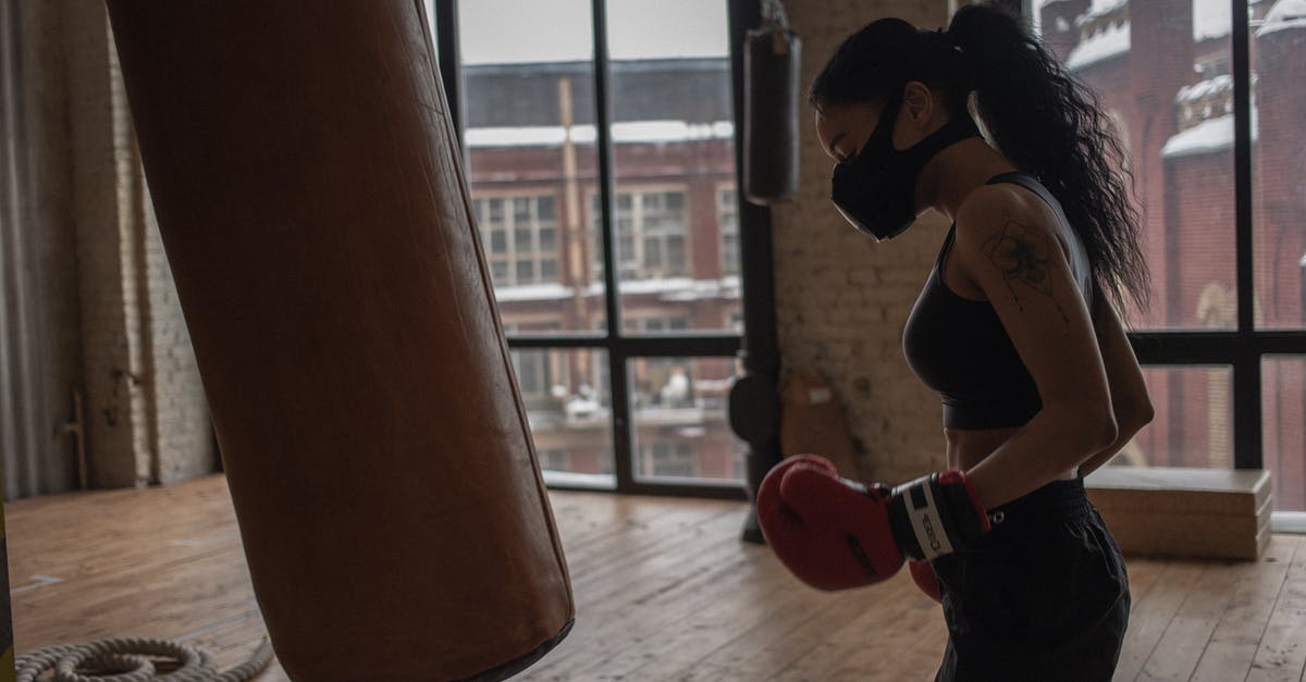Does the DLT-19 Heavy Blaster have any advantage over the RT-97C? - Side view of ethnic female boxer in textile mask against heavy bag during workout in gym Does the DLT-19 Heavy Blaster have any advantage over the RT-97C? - Side view of ethnic female boxer in textile mask against heavy bag during workout in gym