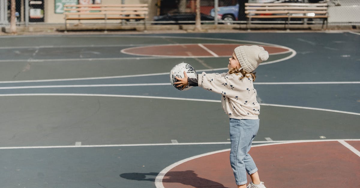 Does the expansion pass also affect the main game? - Cheerful girl playing ball on sport ground