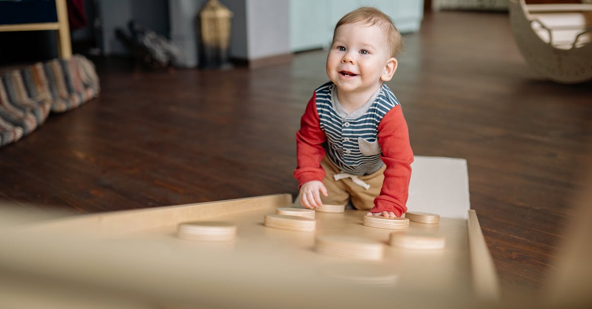 Does Topaz have any usage? - Boy in Black and White Striped Long Sleeve Shirt Sitting on Floor