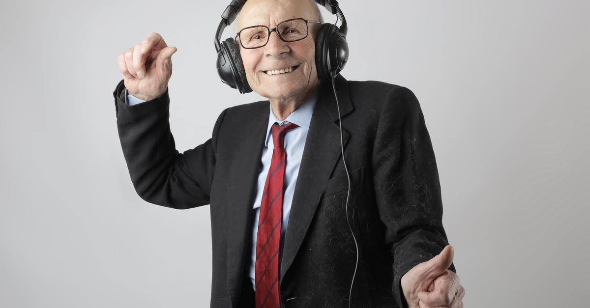 Dragon Age Inquisition Content installing - Cheerful elderly man listening to music in headphones