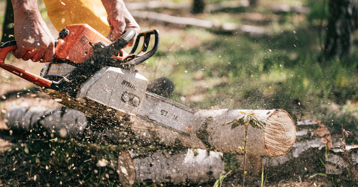 Dropper/hopper chains not working as expected - Person Holding Chainsaw