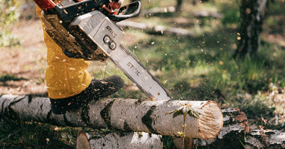 Dropper/hopper chains not working as expected - Photo of Person Using Chainsaw