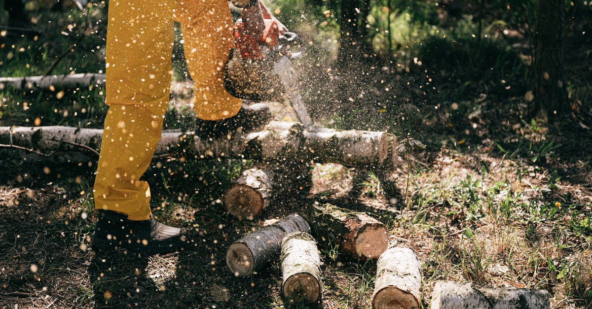 Dropper/hopper chains not working as expected - Person in Yellow Pants and Brown Boots Using Chainsaw