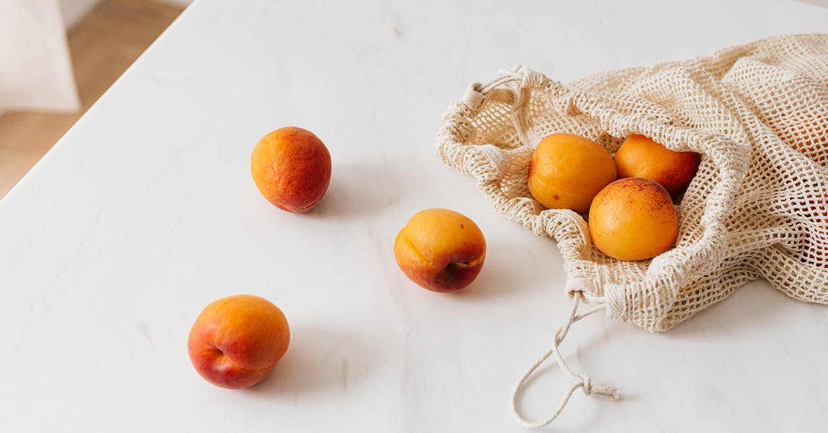 Dwarves not dumping Refuse from former Refuse stockpile - Organic sweet apricots in cotton sack placed on table