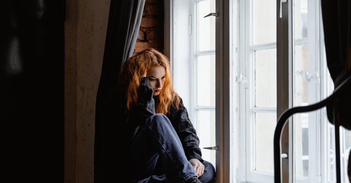 End Portal did not activate - Woman in Black Leather Jacket Sitting on Brown Wooden Floor