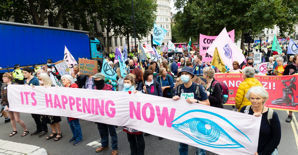 Event Campaigns and Grand Prize - Demonstration of people wearing masks with placards and banners