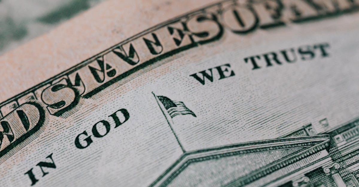 Everdrive save states, how is it possible? - Closeup of ten dollar with inscription In God We Trust bill placed on table with different money