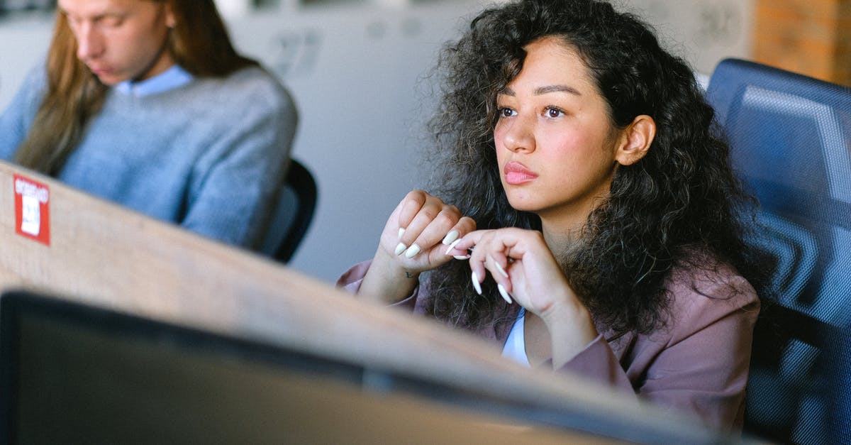 Explaining the solution for this treetop area puzzle - High angle of concentrated female employee sitting at table in open space and thoughtfully looking away