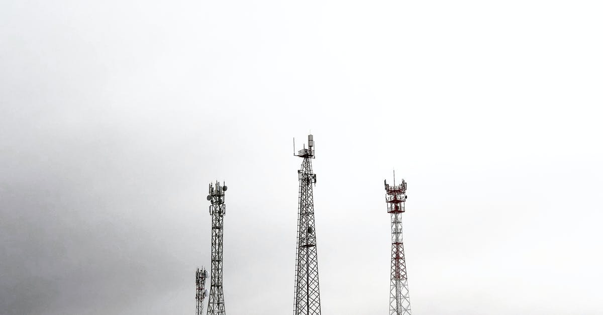 Extend redstone signal maintaining signal strength - Red and White Tower Under Cloudy Sky