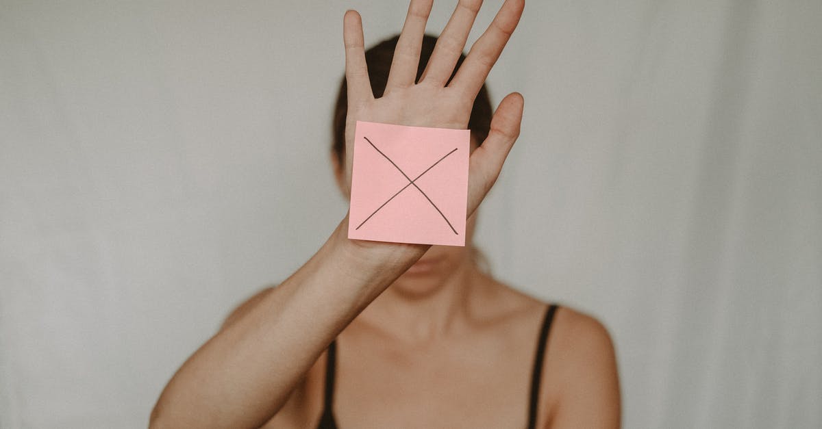 Extend redstone signal maintaining signal strength - Unrecognizable young woman demonstrating prohibition sign showing gesture of refuse using hand and note with sign stop