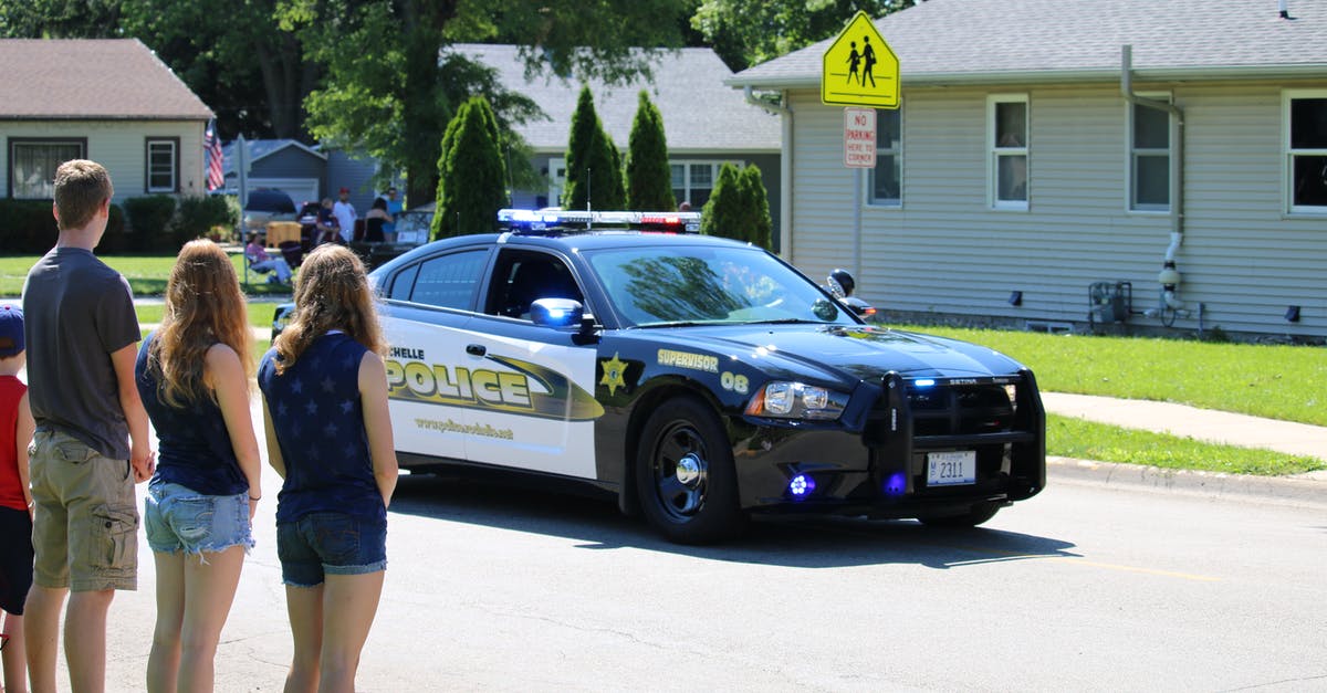 Fallout 4 mod load order - People Looking at Police Car Passing through Neighbourhood