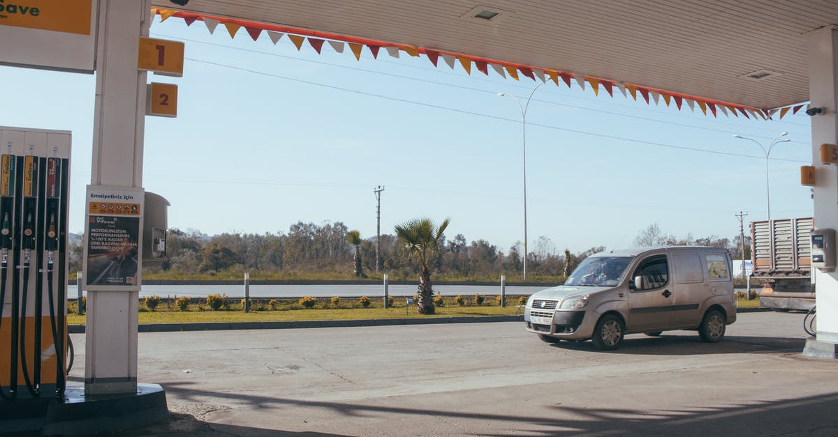 Fill and Replace command with prefilled dispenser? - Car near gas station against cloudless sky