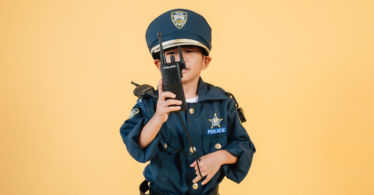 Friendly battle card level cap - Asian boy in police uniform against yellow background