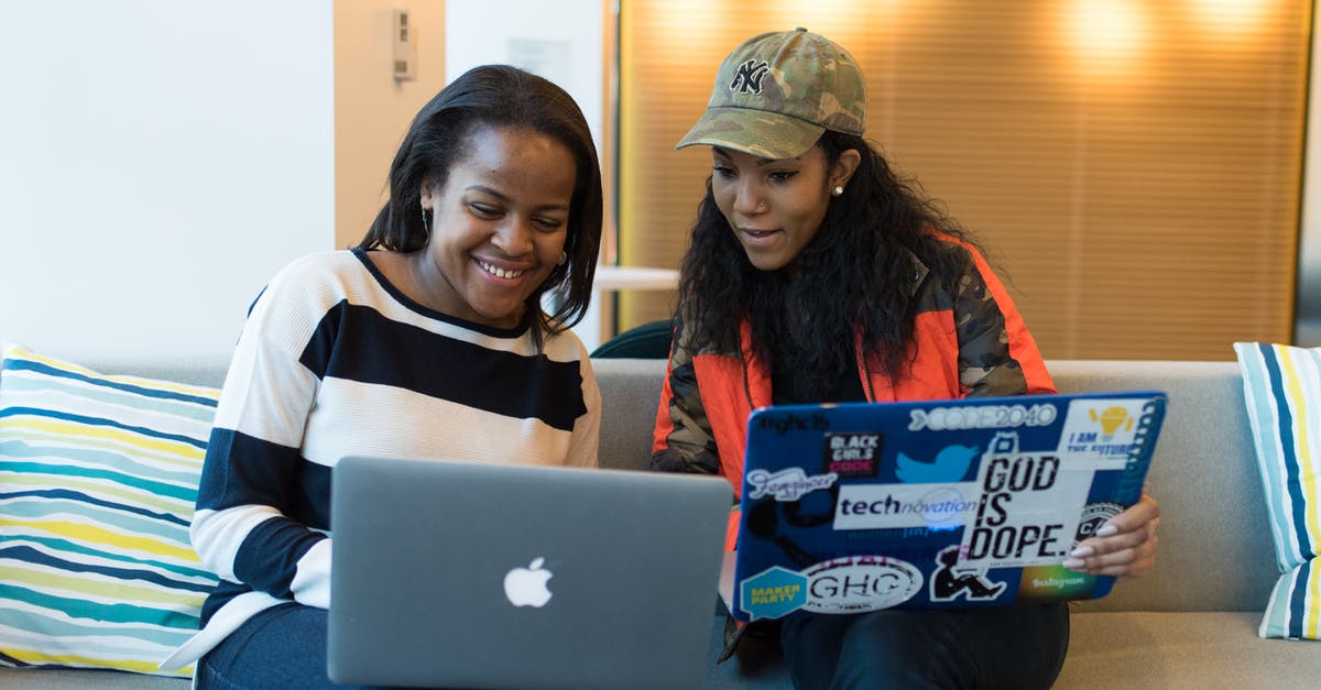 Game sharing not working - Two Women Holding Laptop