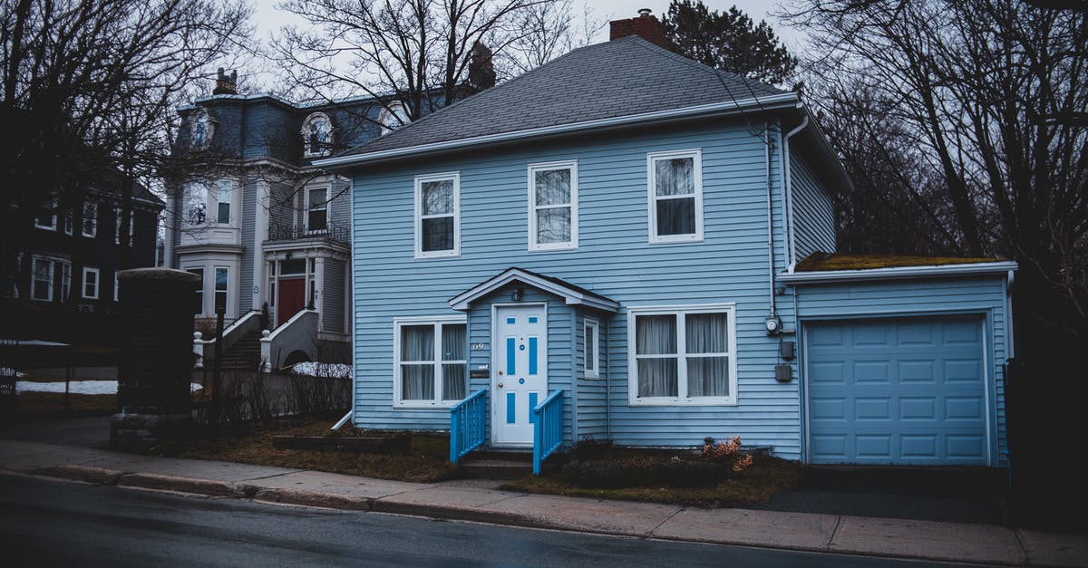 Hamachi private Lan minecraft - Old residential house trimmed with light blue siding and garage