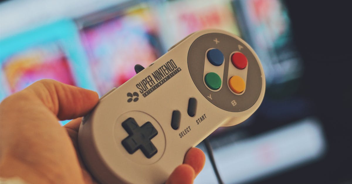 Has Nintendo ever released previously "unreleased" games? - Person Holding White Snes Controller