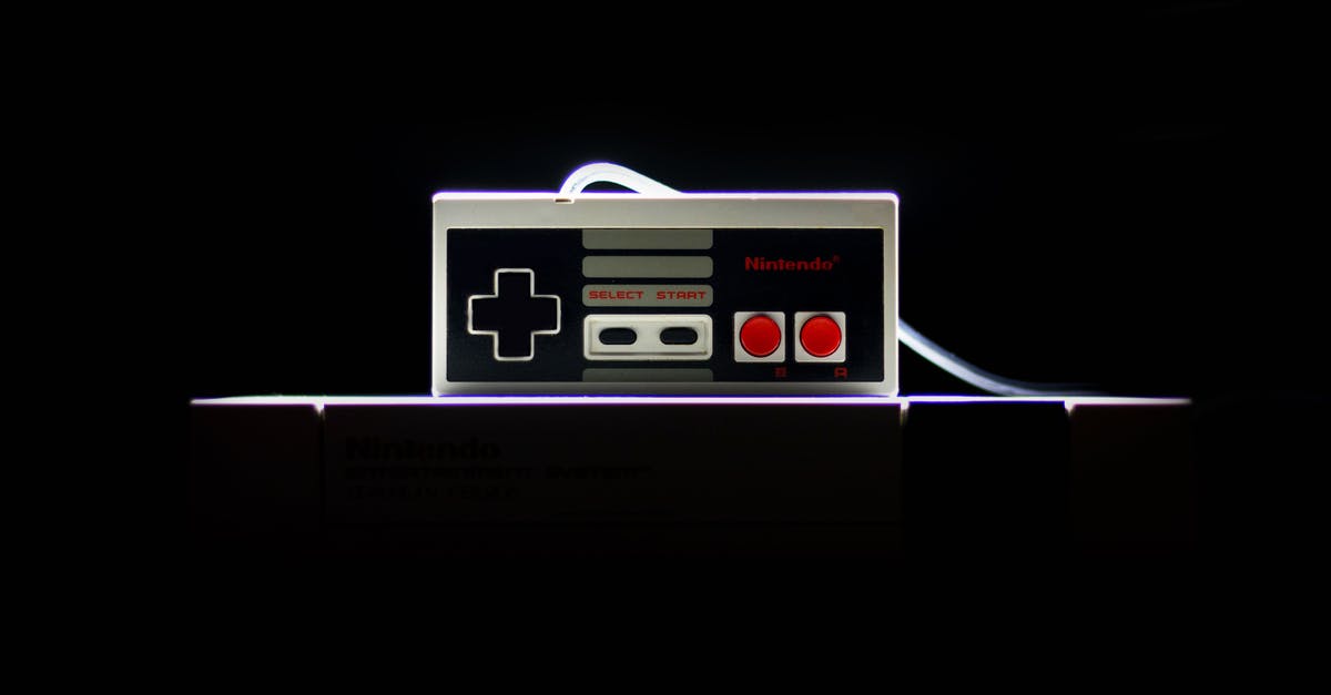 Has Nintendo ever released previously "unreleased" games? - Low-light Photo Of Nes Controller