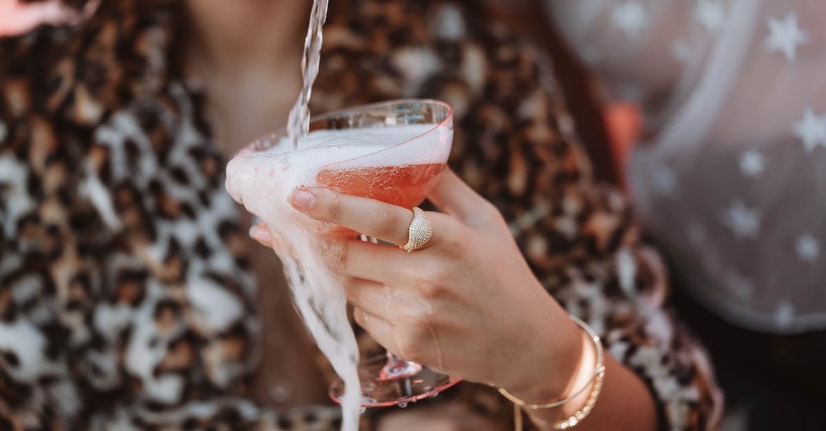 Have portals stopped spilling XM? - Woman Holding Clear Drinking Glass With Red Liquid