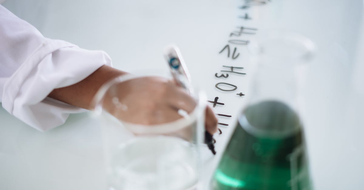 Health regeneration items not working? - Body part of unrecognizable scientist in white uniform writing down formula after providing chemical research with fluid in flask during science lesson in university