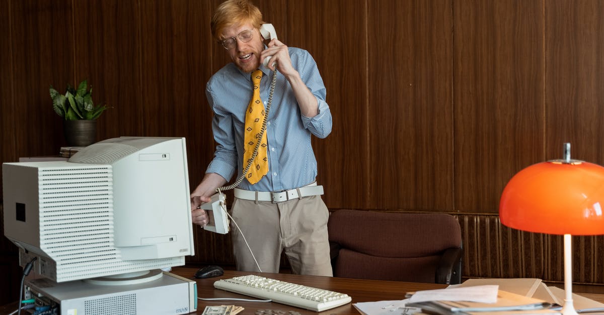 How can I backup NDS .sav files to my computer? - A Man Talking on the Telephone while Standing 