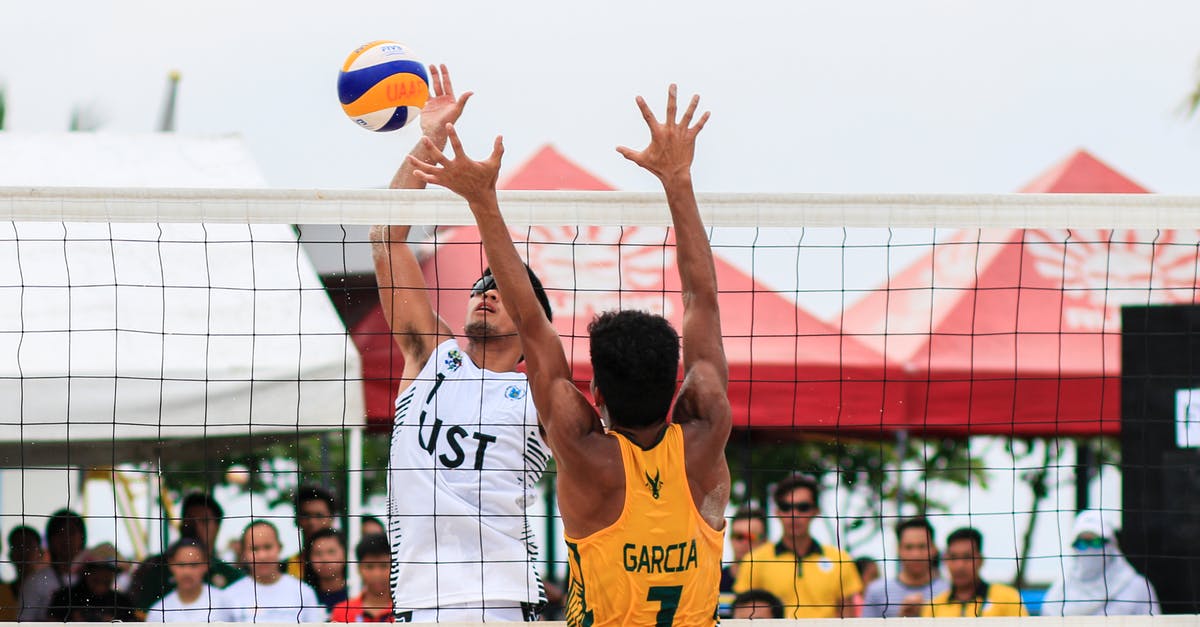 How can I block a player on the IGS server? - Two Men Playing Volleyball Near Red Canopy