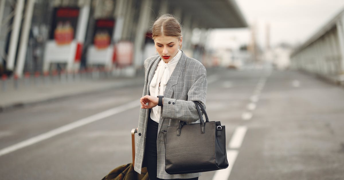 How can I check my framerate in Microsoft Flight Simulator? - Worried young businesswoman with suitcase hurrying on flight on urban background