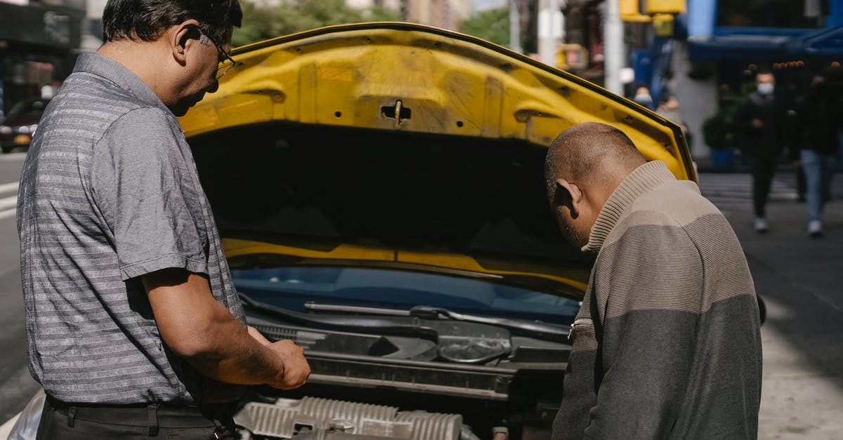 How can I compact my Scrap Mechanic logic down? - Ethnic mechanic checking car standing near man