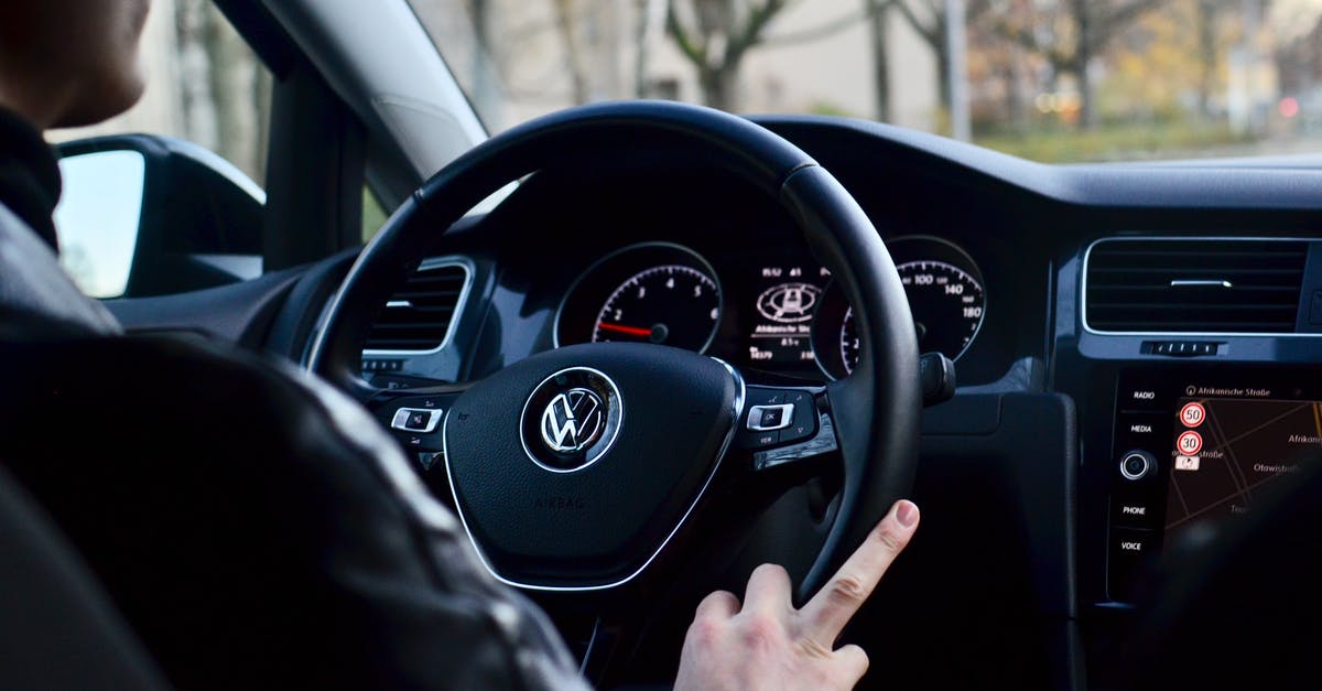 How can I control where my enemy spawns troops? - Back view of crop anonymous male driving contemporary transport while turning steering wheel in daylight