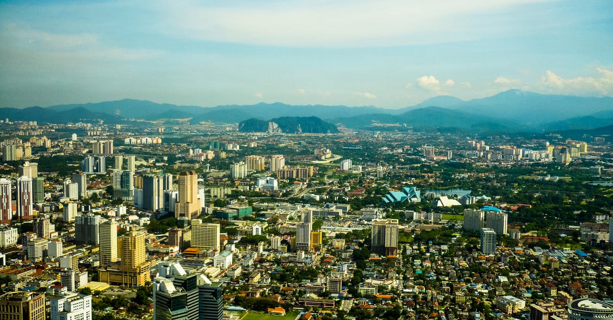 How can I enable mods in Cities Skylines? - Aerial View of City Buildings