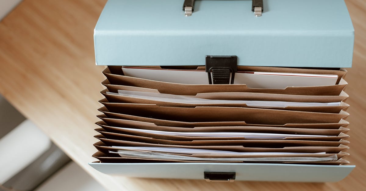 How can I find surface data points? - From above of briefcase for documents with papers placed on wooden table in daytime