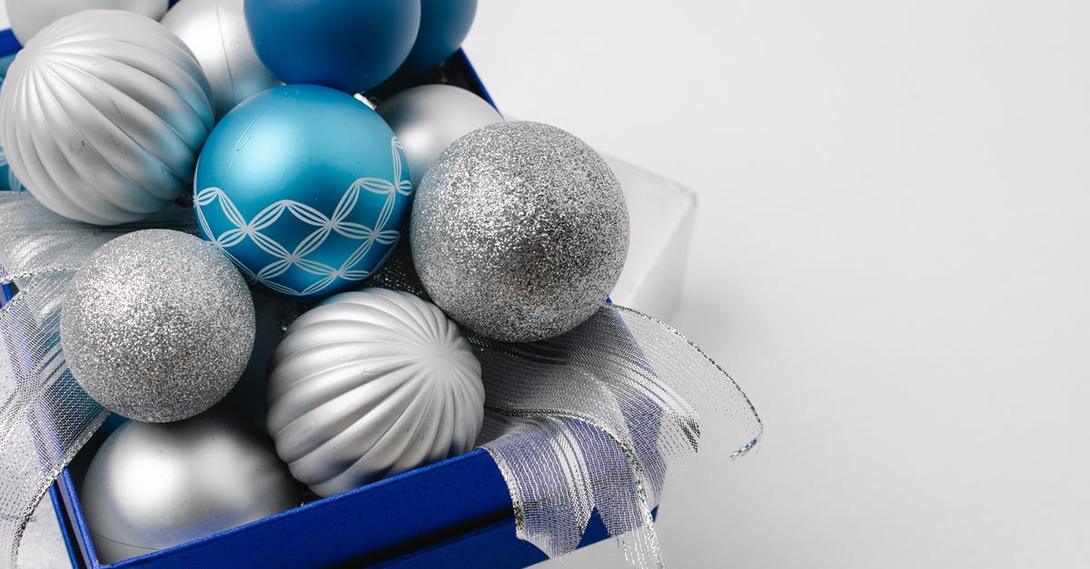 How can I get special symbols for my Mii nickname? - Festive sparkling silver and blue baubles in box